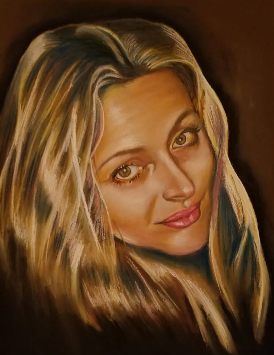 Pastel portrait of Irina Koshel with blonde hair and warm brown eyes against a dark brown background, created by Ozzie Ghani in 2016.